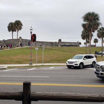 The Bar With No Name - a parking lot with cars - Sports Bars Near Me - St. Augustine, Florida