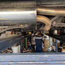 43's Muffler & Brakes - The team working hard to install the headers.