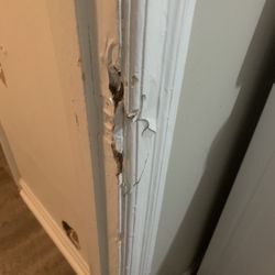 JB Computers - Damage to wall and door.