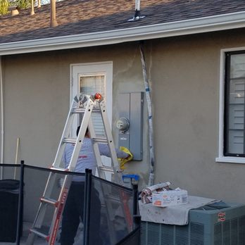 Rey Electric - The final Stucco Repair looks awesome minus the black mastic mess that was used to make it leak proof. - Electricians Near Me Rey Electric - The final Stucco Repair looks awesome minus the black mastic mess that was used to make it leak proof. - Electricians Near Me