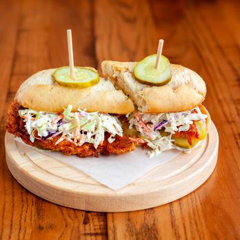 The Eagle Detroit - two sandwiches with pickles and cole slaw - Southern Near Me - Detroit, Michigan The Eagle Detroit - two sandwiches with pickles and cole slaw - Southern Near Me - Detroit, Michigan