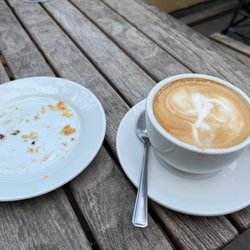 Scooter Caffè - Lovely cappuccino art, and the remnants of my chocolate hazelnut croissant. ;)