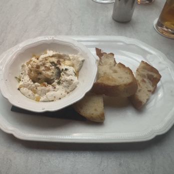 Trattoria Sofia - Whipped Ricotta - warm spicy honey, fried garlic, Calabrese pepper & mint w/ toasted ciabatta - Italian Near Me - Houston, Texas Trattoria Sofia - Whipped Ricotta - warm spicy honey, fried garlic, Calabrese pepper & mint w/ toasted ciabatta - Italian Near Me - Houston, Texas