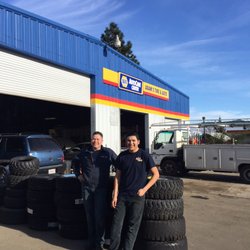 Adams Tire & Auto Service - Adam and son Brandon taking a little break in the warm sun.