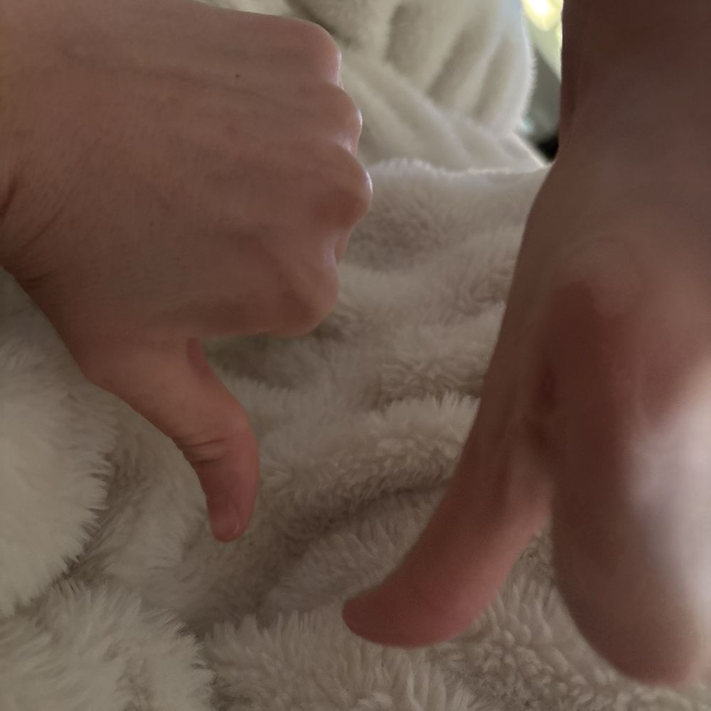 two hands doing thumbs down two hands doing thumbs down