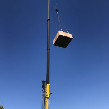 Cannonball Movers - Using a crane to hoist hot tub - Movers Near Me
