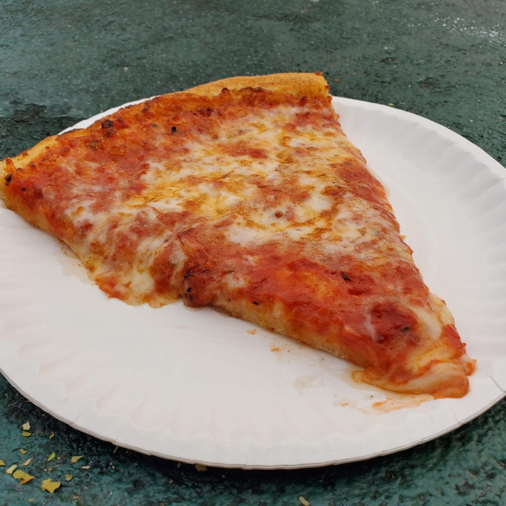 A slice of cheese pizza from Bills Pizza in Old Orchard