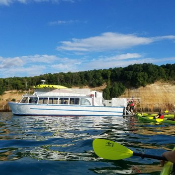 Pictured Rocks Kayaking - The boat that drove the tour group to our starting point (about 30 mins away) and picked us up. - Tours Near Me - Munising, Michigan Pictured Rocks Kayaking - The boat that drove the tour group to our starting point (about 30 mins away) and picked us up. - Tours Near Me - Munising, Michigan