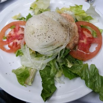 John Henry's - Garden salad that comes with your entree.  You'd think it would be presented a little better, with a big mound of raw onions...umm. - American Near Me - Palm Springs, California