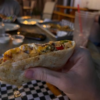 Hidden Hideaway Bar & Grill - Gourmet beef crunch wrap supreme - Bars Near Me - Fredericksburg, Texas Hidden Hideaway Bar & Grill - Gourmet beef crunch wrap supreme - Bars Near Me - Fredericksburg, Texas