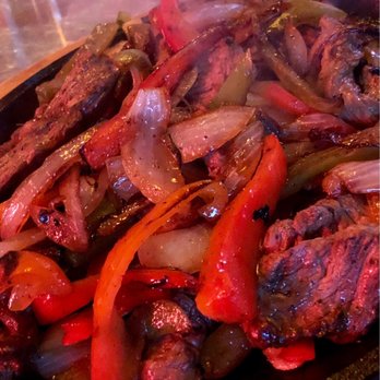 Rio Grande Cafe - Close up of fajitas. - Mexican Near Me - Salt Lake City, Utah Rio Grande Cafe - Close up of fajitas. - Mexican Near Me - Salt Lake City, Utah