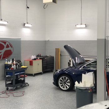 Detail Authority - Inside the shop, working on a blue Model 3 - Auto Detailing Near Me - Fairfax, Virginia