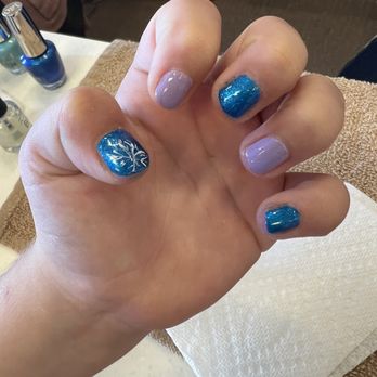 Nail Studio - Another daughter's painted nails after basic manicure. My daughter picked all of the colors and snowflake. - Nail Salons Near Me - Spanish Fort, Alabama