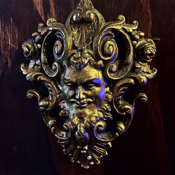Veganized - a bronze face on a wooden surface - Vegan Near Me - New Brunswick, New Jersey