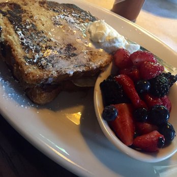 Meddlesome Moth - French Toast Sandwich: Smoked pit ham, Tillamook cheddar, runny egg, battered brioche, sorghum cream - Bars Near Me - Dallas, Texas Meddlesome Moth - French Toast Sandwich: Smoked pit ham, Tillamook cheddar, runny egg, battered brioche, sorghum cream - Bars Near Me - Dallas, Texas