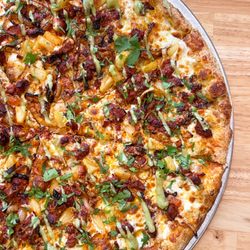 Sgt. Pepperoni's Pizza Store - May '23 Pie of the Month! Our famous dough layered with house-made green salsa, mozzarella, pineapple marinated al pastor (pork)