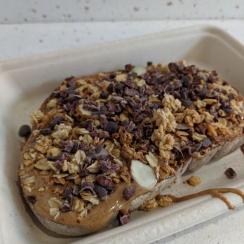 Roots & Rye - Toast with Almond Butter, Honey Almonds, and Cocoa Nibs - Acai Bowls Near Me - Pasadena, California Roots & Rye - Toast with Almond Butter, Honey Almonds, and Cocoa Nibs - Acai Bowls Near Me - Pasadena, California