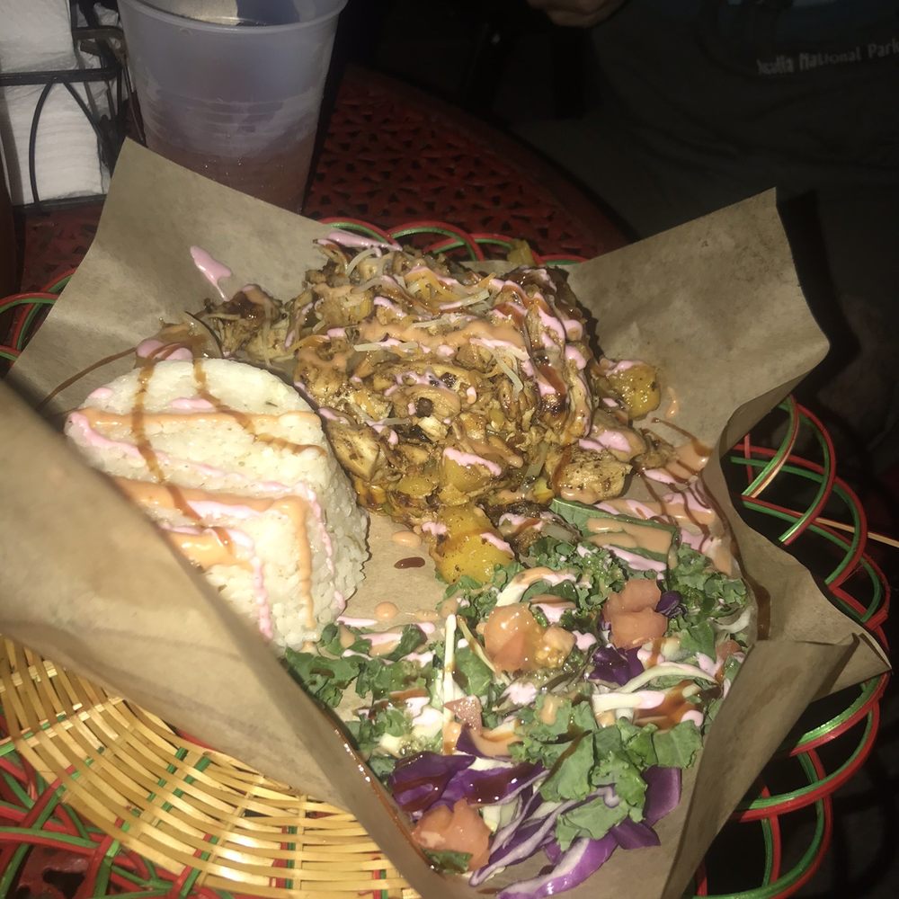 Stuffed pineapple with chicken and a side of coconut rice