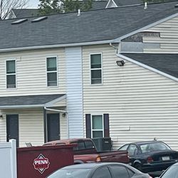 High Pointe Club Apartments - More siding falling off.
