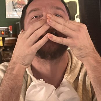 The Peanut - Harry licking wing sauce off his hands - Dive Bars Near Me - Kansas City, Missouri The Peanut - Harry licking wing sauce off his hands - Dive Bars Near Me - Kansas City, Missouri