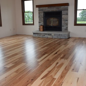 The Flooring Center - a fireplace in the middle of the room - Flooring Near Me - Crofton, Maryland The Flooring Center - a fireplace in the middle of the room - Flooring Near Me - Crofton, Maryland