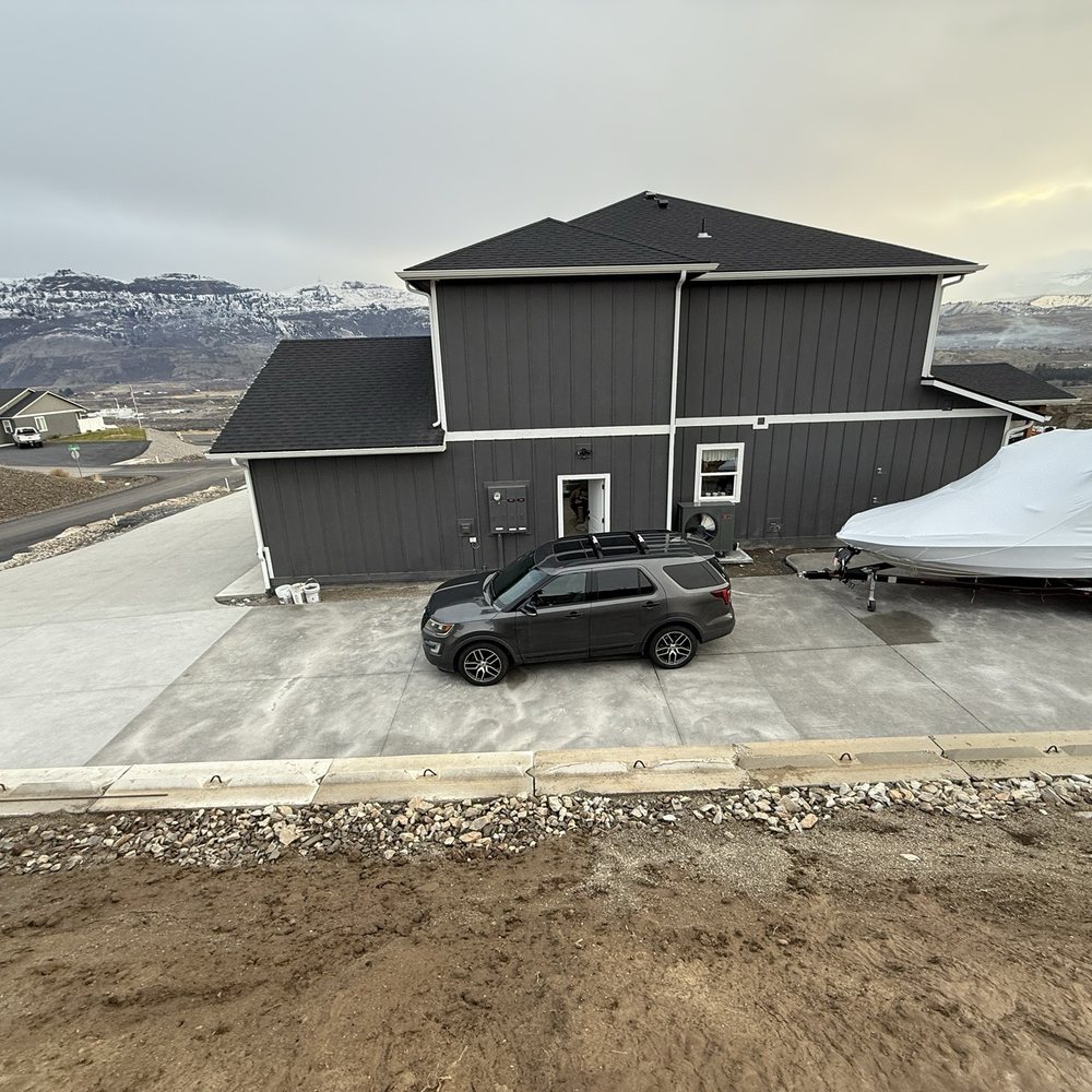 Black Diamond Construction - Black Diamond's concrete pad to the right, the subsequently hired concrete company's work to the left. - Roofing Near Me - Wenatchee, Washington Black Diamond Construction - Black Diamond's concrete pad to the right, the subsequently hired concrete company's work to the left. - Roofing Near Me - Wenatchee, Washington
