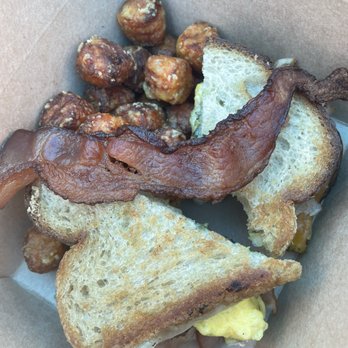 Over Easy - Surprise - Basil sandwich :) with side of bacon & sweet tots - Breakfast & Brunch Near Me - Surprise, Arizona Over Easy - Surprise - Basil sandwich :) with side of bacon & sweet tots - Breakfast & Brunch Near Me - Surprise, Arizona