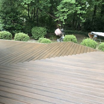 Turtle Rock Construction - a man on a bike on a deck - General Contractors Near Me - Virginia Beach, Virginia Turtle Rock Construction - a man on a bike on a deck - General Contractors Near Me - Virginia Beach, Virginia