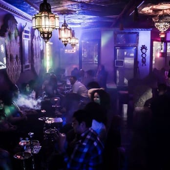 Hookah Hut - a group of people in a dimly lit room - Hookah Bars Near Me - Redondo Beach, California Hookah Hut - a group of people in a dimly lit room - Hookah Bars Near Me - Redondo Beach, California