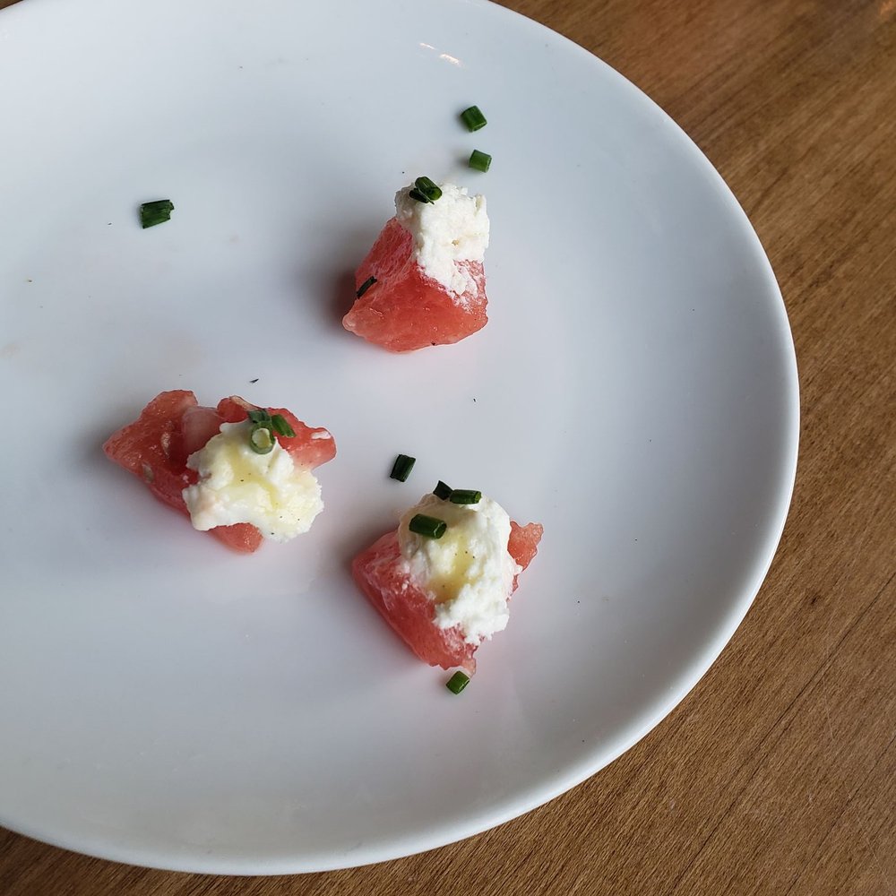 Carte Blanche - Amuse-bouche watermelon topped with goat cheese - French Near Me - Hamburg, New York Carte Blanche - Amuse-bouche watermelon topped with goat cheese - French Near Me - Hamburg, New York