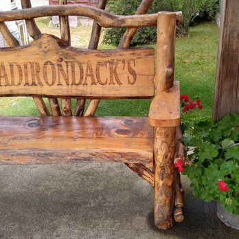 The Hungry Crow - a wooden bench on a porch - Cheese Shops Near Me - North Creek, New York The Hungry Crow - a wooden bench on a porch - Cheese Shops Near Me - North Creek, New York