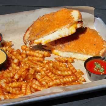 Tin Cup - Parmesan-crisped bread with cheddar, asadero blend, Swiss, and American cheese. Try with the House Marinara! - Burgers Near Me - Lee's Summit, Missouri Tin Cup - Parmesan-crisped bread with cheddar, asadero blend, Swiss, and American cheese. Try with the House Marinara! - Burgers Near Me - Lee's Summit, Missouri