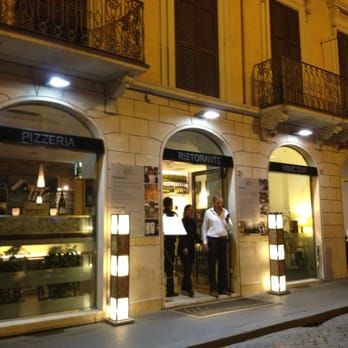Life - Entrance. The owner is ordering a taxi for another patron. - Italian Near Me - Rome, RM Life - Entrance. The owner is ordering a taxi for another patron. - Italian Near Me - Rome, RM