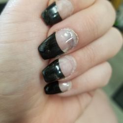 Noble Nails - You can clearly see the "air bubbles" underneath and the nail underneath wasn't files properly.