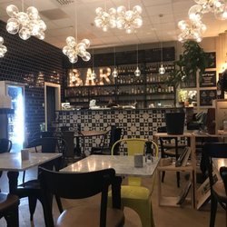 Taverna Gusto - The "pizza bar" with open seating, no table reservations in this section. Contemporary and gorgeous!