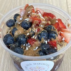 Red Hibiscus Juice - Açaí bowl with toppings.