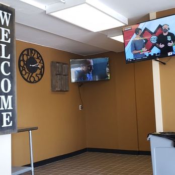 Top Corned Beef - a kitchen with a television and a clock - American Near Me - Milwaukee, Wisconsin