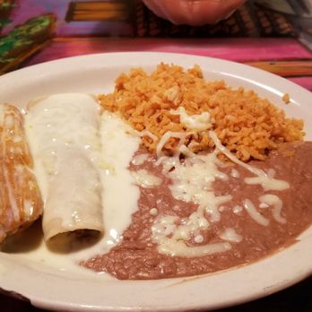 El Meskal - Beef enchilada, beef tamale, rice and beans all topped with white queso. - Mexican Near Me - Gonzales, Louisiana