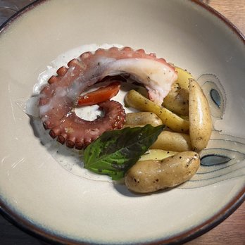 Strega - Octopus appetizer. Chewy and flavorless. The sauce tasted good and I wanted bread to dip into it. No bread! - Wine Bars Near Me - Milford, Connecticut
