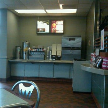 McDonald's - a woman sitting at a table - Fast Food Near Me - Raleigh, North Carolina