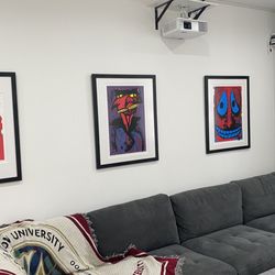 Jimmy's Custom Framing - Photo from a collector's home with three custom framed pieces