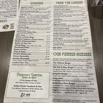 The Hideout - Menu from The Hideout in Clawson, MI, displaying a variety of American dishes including starters like spinach & artichoke dip, chicken strips, and homemade potato skins. It features salads such as Greek, chef, and fried chicken salad, along with a selection of burgers including the Hideout Burger, Jalapeño Burger, and Build-Your-Own options. The menu also lists sides like side salad, cobb salad, and mozzarella sticks, with prices and detailed descriptions of ingredients and preparation methods. - Sports Bars Near Me - Clawson, Michigan