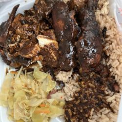 Jamaican Vibes Restaurant - Jerk Chicken Meal with cabbage and rice and beans