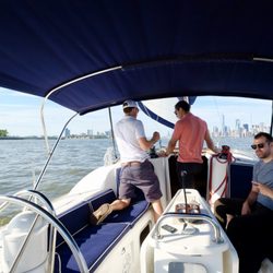 Sail Away NY - Captain Troy explains some of the mechanics of a sailboat to Alex, while Tanner and Vicki relax