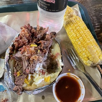 Hard Eight BBQ - Brisket baked potato, barbecue sauce and corn on the cob - Barbeque Near Me - The Colony, Texas