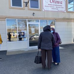 Orawa Bakery & Delicatessen - Standing in line with the Polish ladies, going to get our kielbasa!!! Only 2 customers at a time in the store.