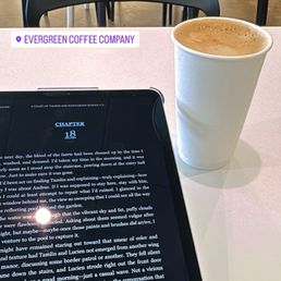 a tablet and a cup of coffee a tablet and a cup of coffee