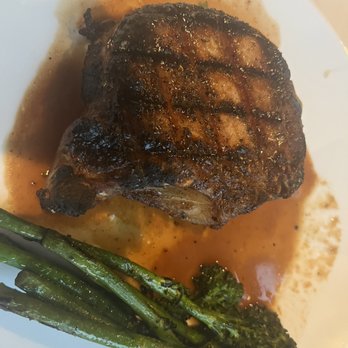 SAVI Cucina + Wine Bar - Grill pork chop with broccolini - Wine Bars Near Me - Mount Pleasant, South Carolina SAVI Cucina + Wine Bar - Grill pork chop with broccolini - Wine Bars Near Me - Mount Pleasant, South Carolina
