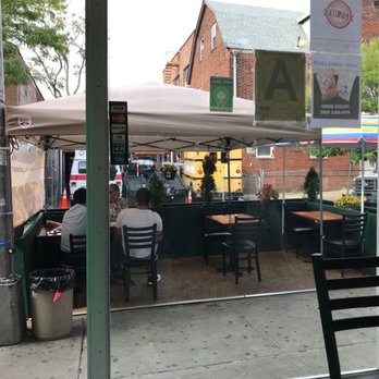 Hamro Bhim's Cafe - a man sitting at a table - Himalayan/Nepalese Near Me - Jackson Heights, New York