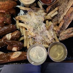 This was the appetizer sampler. Wings, parm fries, cheesesteak eggrolls and pretzels. This was the appetizer sampler. Wings, parm fries, cheesesteak eggrolls and pretzels.